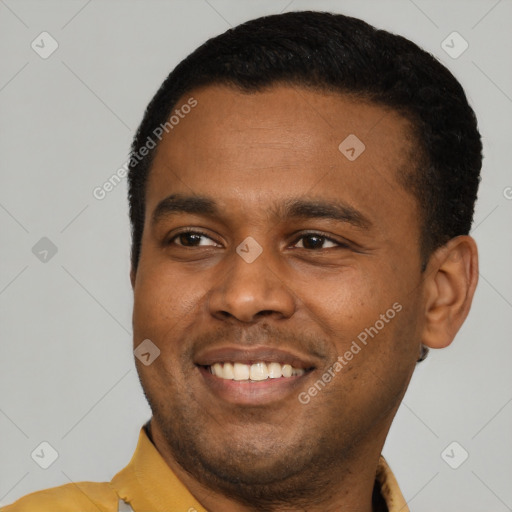 Joyful latino young-adult male with short  black hair and brown eyes