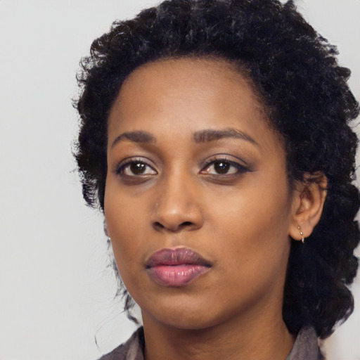 Neutral black young-adult female with long  black hair and brown eyes