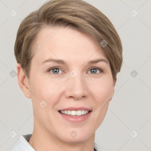 Joyful white young-adult female with short  brown hair and grey eyes