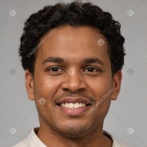 Joyful latino young-adult male with short  brown hair and brown eyes