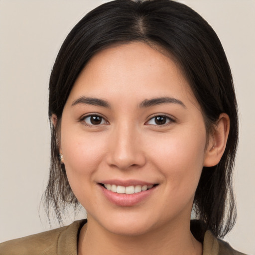 Joyful white young-adult female with medium  brown hair and brown eyes