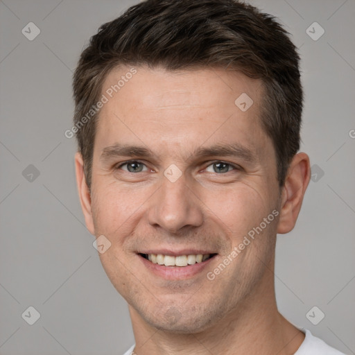 Joyful white adult male with short  brown hair and brown eyes