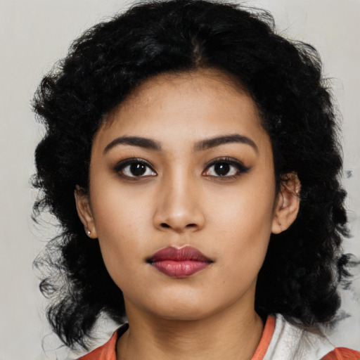 Neutral latino young-adult female with medium  black hair and brown eyes