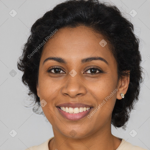 Joyful black young-adult female with long  brown hair and brown eyes