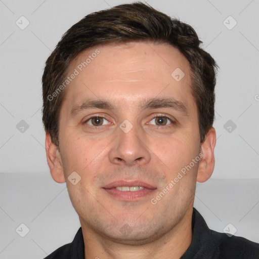 Joyful white adult male with short  brown hair and brown eyes