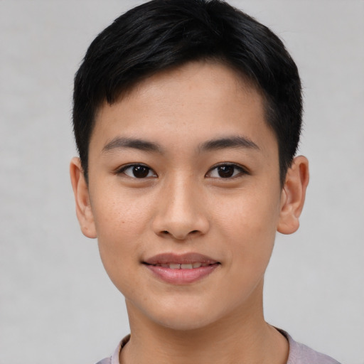 Joyful asian young-adult male with short  brown hair and brown eyes