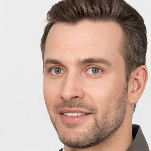 Joyful white young-adult male with short  brown hair and brown eyes