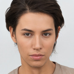 Neutral white young-adult female with short  brown hair and brown eyes