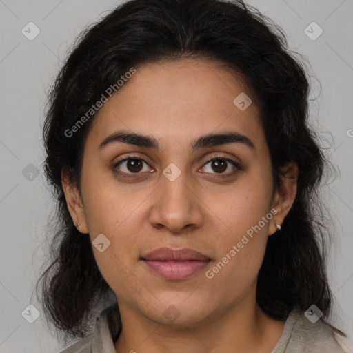 Joyful latino young-adult female with medium  brown hair and brown eyes