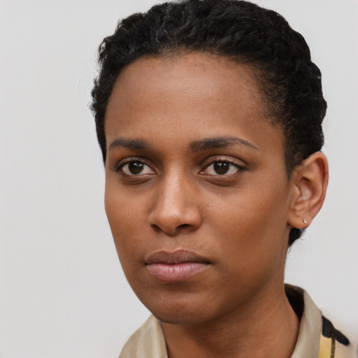 Neutral black young-adult female with short  black hair and brown eyes