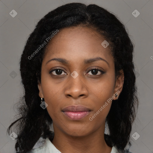 Joyful black young-adult female with medium  black hair and brown eyes