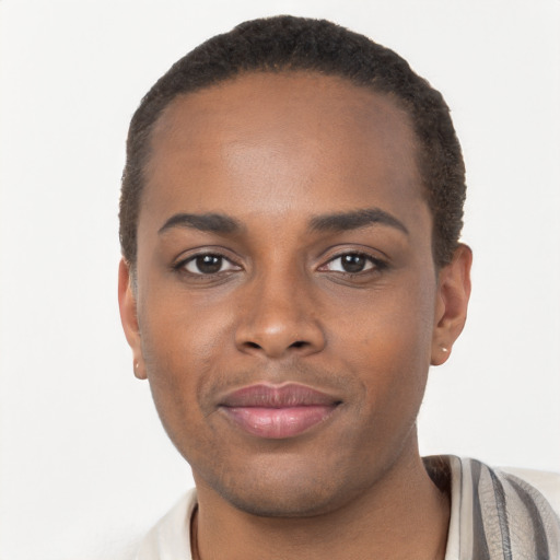 Joyful black young-adult male with short  brown hair and brown eyes