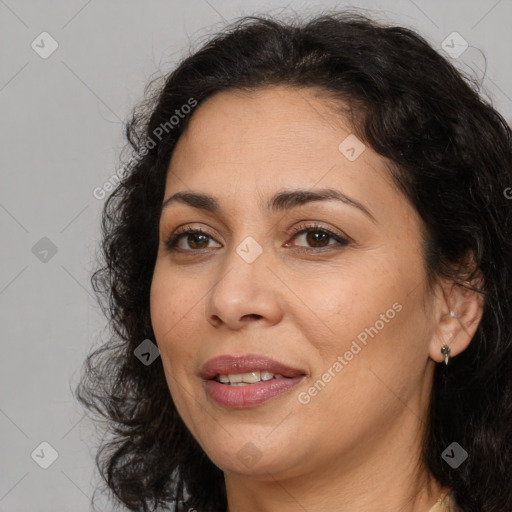 Joyful white adult female with long  brown hair and brown eyes