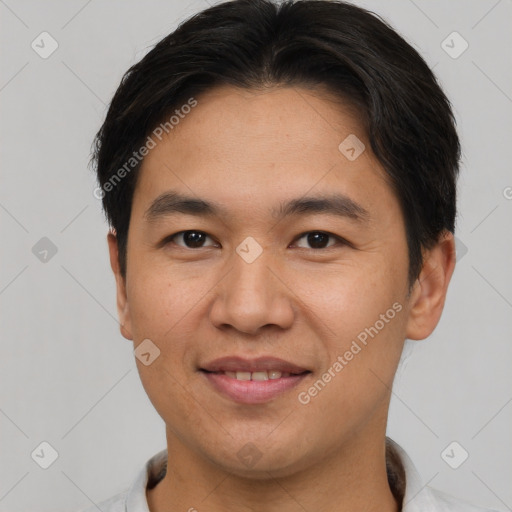 Joyful asian young-adult male with short  brown hair and brown eyes