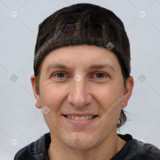 Joyful white adult male with short  brown hair and grey eyes