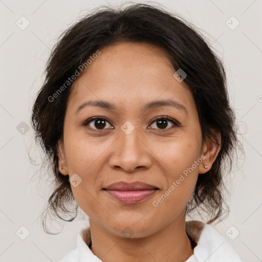 Joyful latino adult female with medium  brown hair and brown eyes