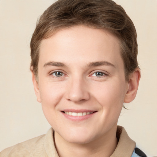 Joyful white young-adult female with short  brown hair and grey eyes