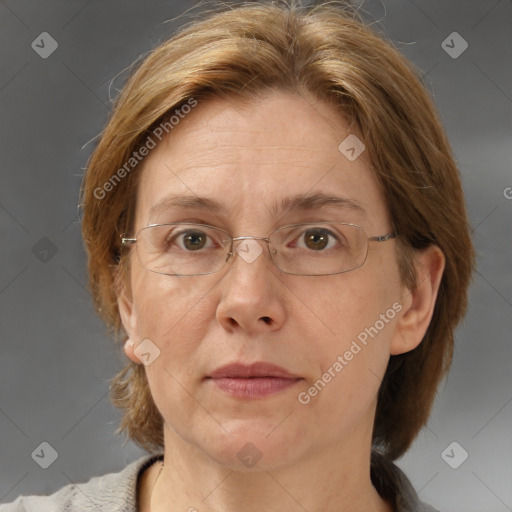 Joyful white adult female with medium  brown hair and blue eyes