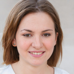 Joyful white young-adult female with medium  brown hair and blue eyes