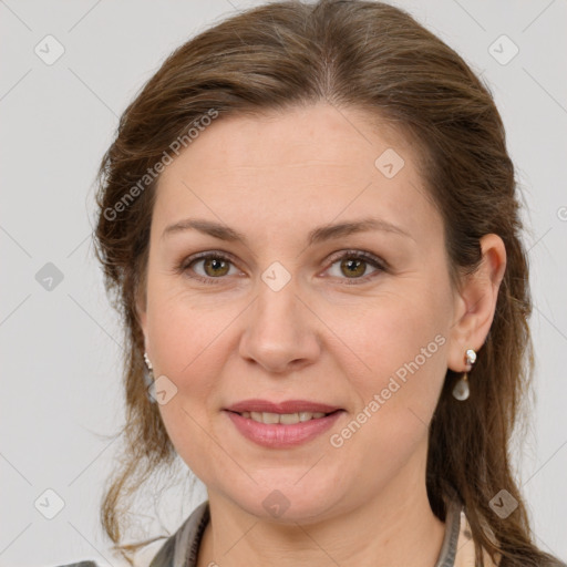 Joyful white adult female with medium  brown hair and grey eyes