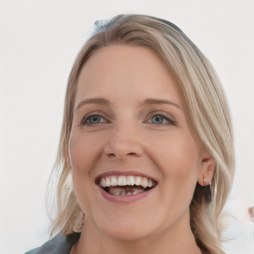 Joyful white young-adult female with medium  brown hair and blue eyes