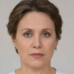 Joyful white adult female with short  brown hair and grey eyes