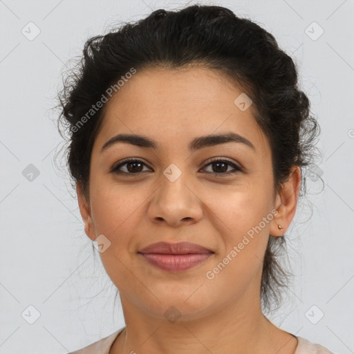 Joyful latino young-adult female with short  brown hair and brown eyes