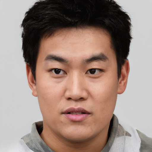 Neutral asian young-adult male with short  black hair and brown eyes