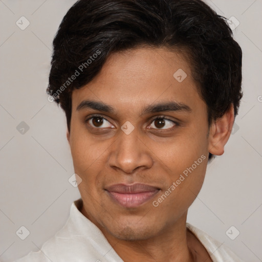 Joyful latino young-adult male with short  brown hair and brown eyes