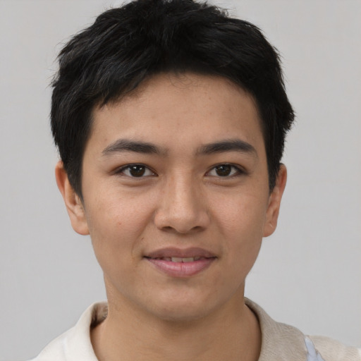 Joyful asian young-adult male with short  brown hair and brown eyes