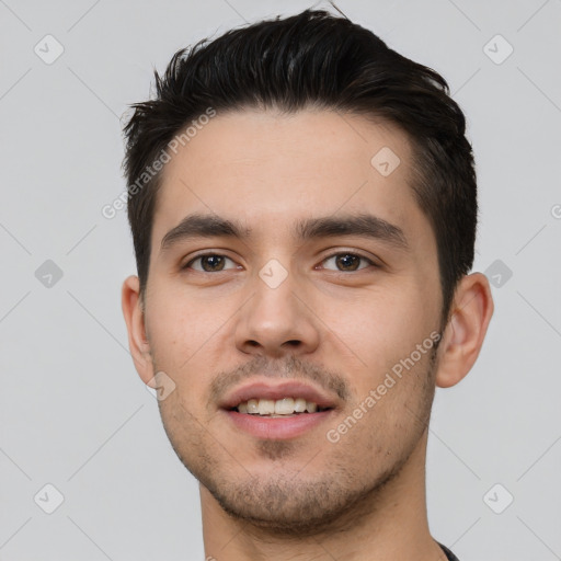 Joyful white young-adult male with short  black hair and brown eyes