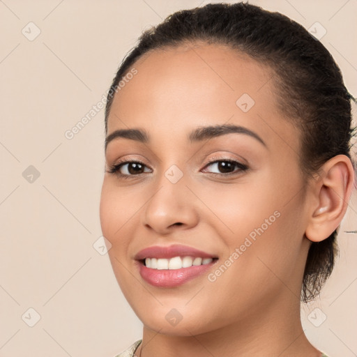 Joyful white young-adult female with long  brown hair and brown eyes