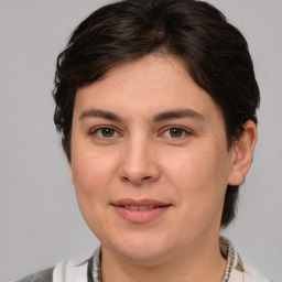 Joyful white young-adult female with medium  brown hair and brown eyes