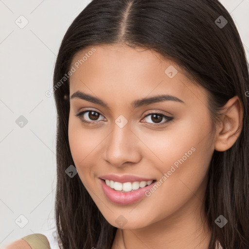 Joyful white young-adult female with long  brown hair and brown eyes