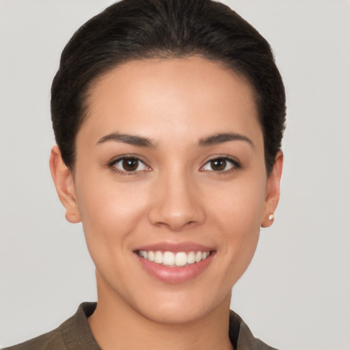 Joyful white young-adult female with short  brown hair and brown eyes