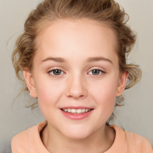 Joyful white child female with medium  brown hair and brown eyes