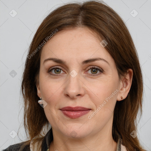 Joyful white adult female with medium  brown hair and grey eyes