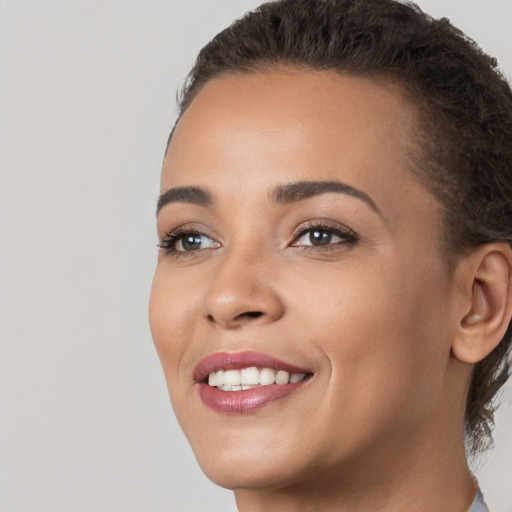 Joyful white young-adult female with short  brown hair and brown eyes