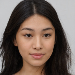 Joyful asian young-adult female with long  brown hair and brown eyes