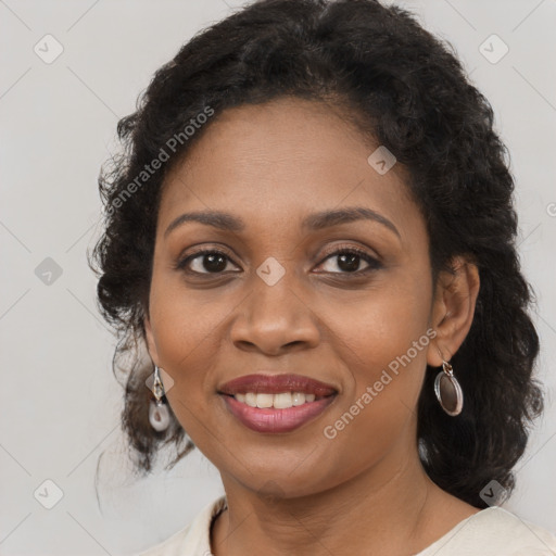 Joyful black adult female with medium  brown hair and brown eyes