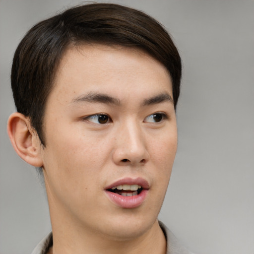 Neutral asian young-adult male with short  brown hair and brown eyes
