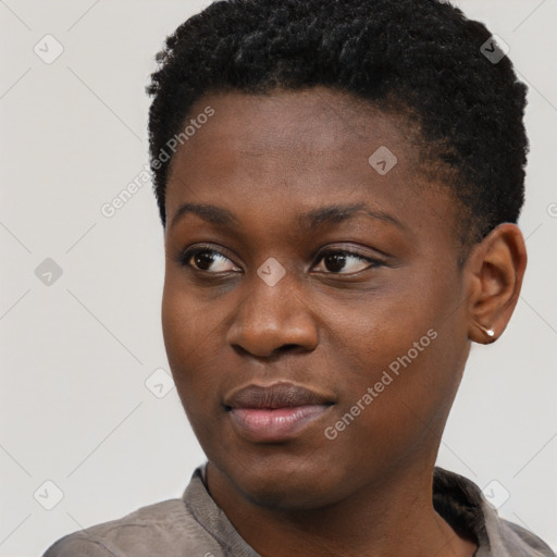 Joyful black young-adult female with short  black hair and brown eyes