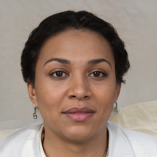 Joyful white adult female with short  brown hair and brown eyes