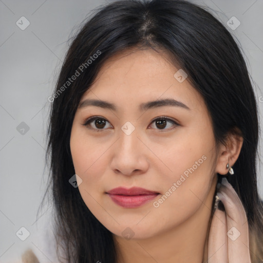 Joyful asian young-adult female with long  brown hair and brown eyes