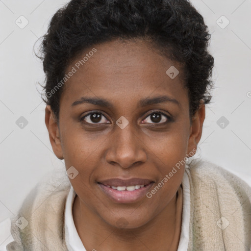 Joyful black young-adult female with short  brown hair and brown eyes