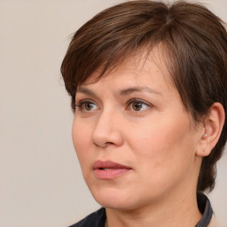 Joyful white adult female with medium  brown hair and brown eyes