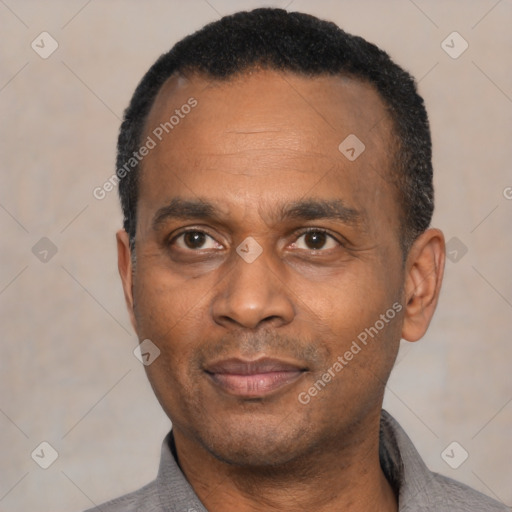 Joyful latino adult male with short  black hair and brown eyes