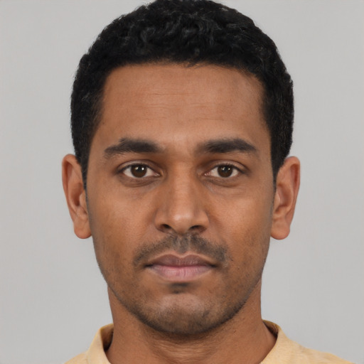 Neutral latino young-adult male with short  black hair and brown eyes