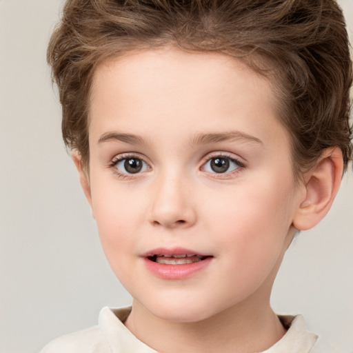 Joyful white child female with short  brown hair and grey eyes