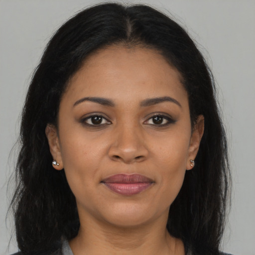 Joyful asian young-adult female with long  brown hair and brown eyes